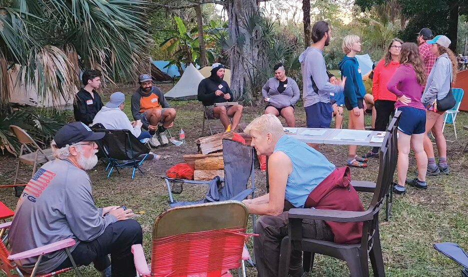 Hikers share stories and tips around the campfire at the Kickoff event in January.